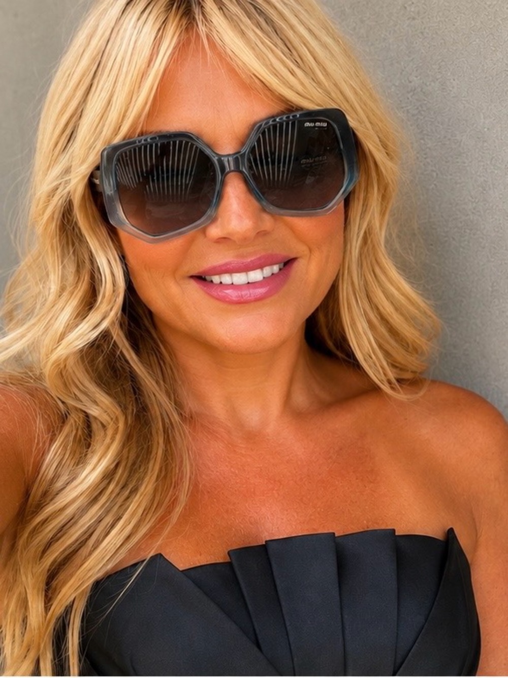 Miu Miu Sunglasses • 55mm lens width; 12mm bridge width; 145mm SMU07V $440